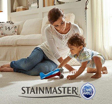 Mother and toddler playing with a toy airplane on Stainmaster® LiveWell™ carpet