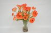 Orange Ranunculus Arrangement In Clear Vase