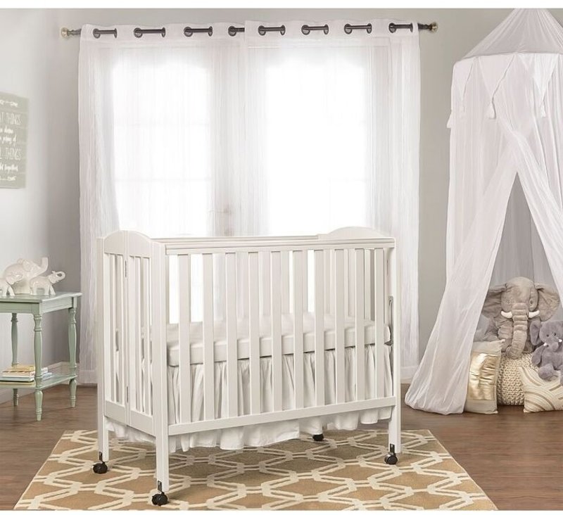 white portable crib