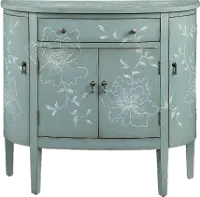 Teal Cabinet With Curved Doors And White Floral Graphics