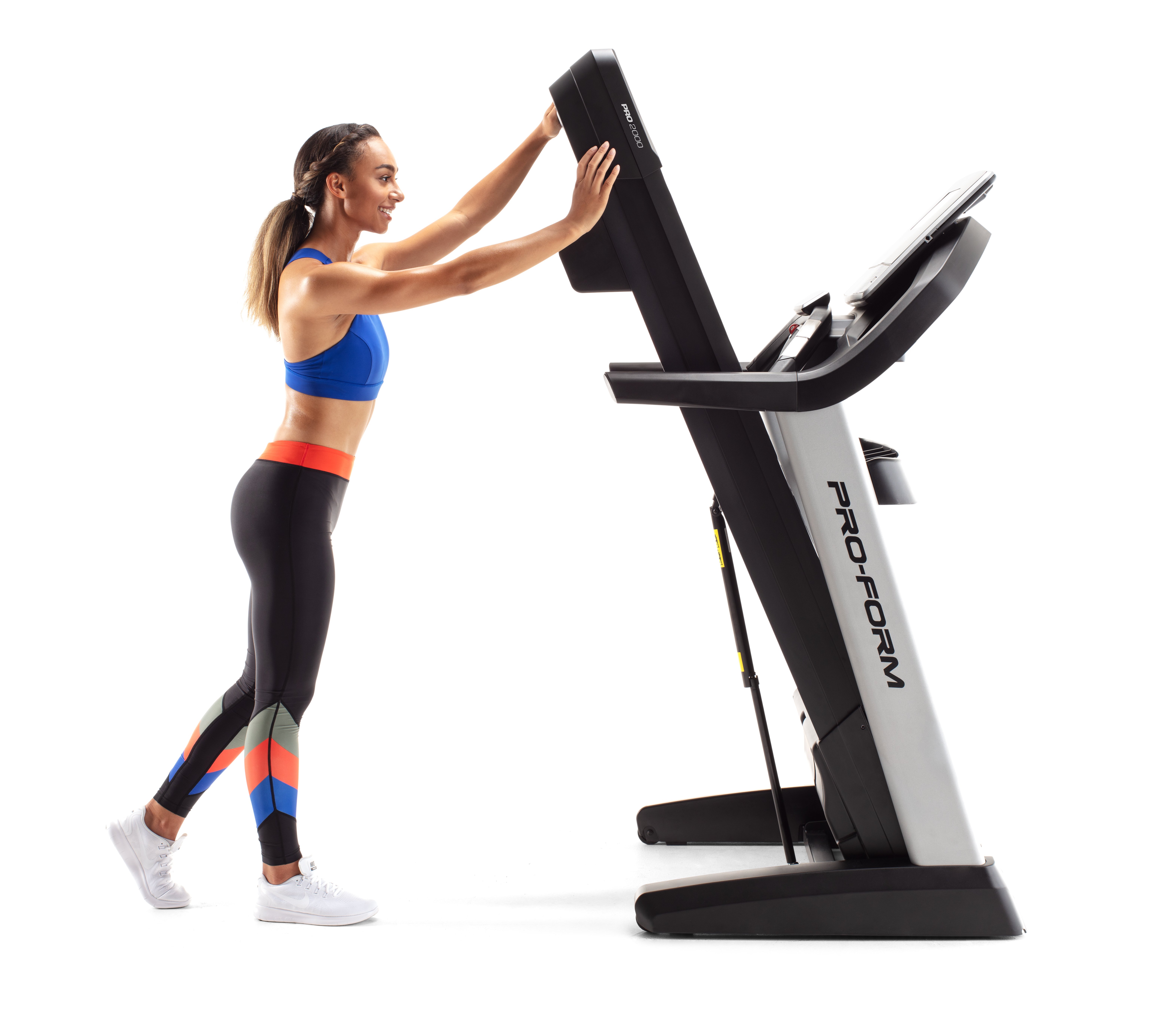woman lifting proform treadmill with easylift assist