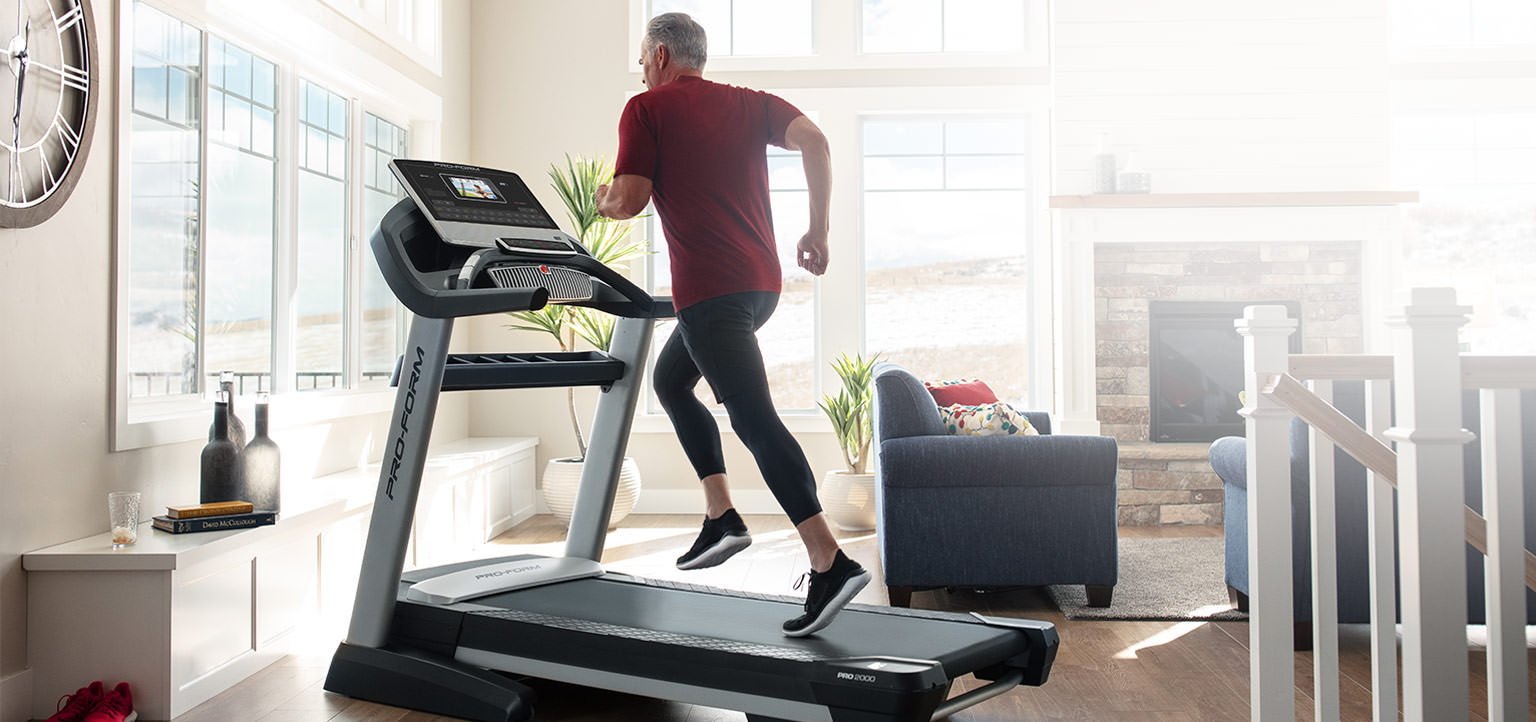 man running on proform treadmill in home