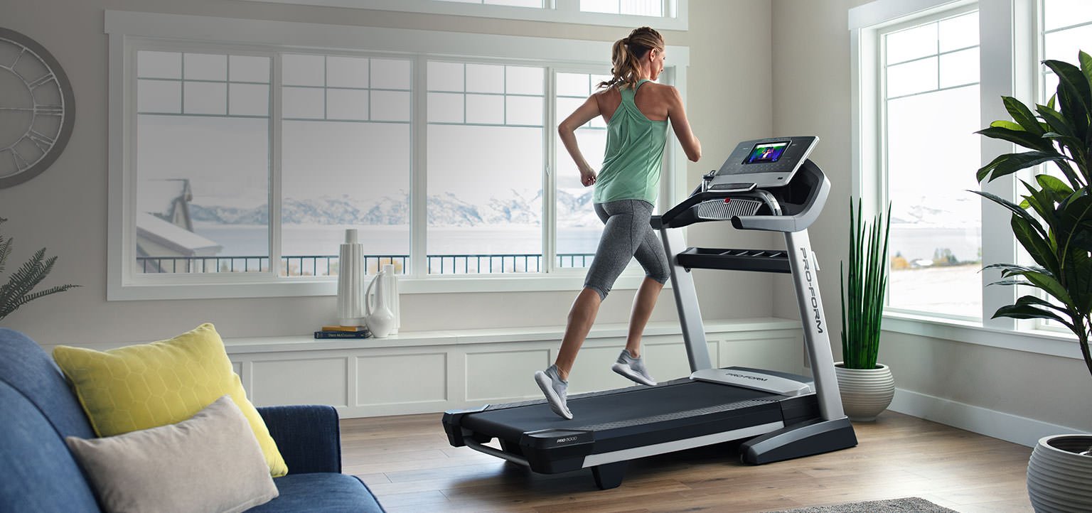 woman running on proform treadmill in home