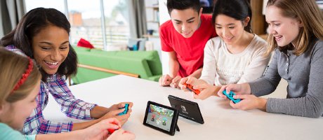people playing Nintendo Switch in tabletop mode