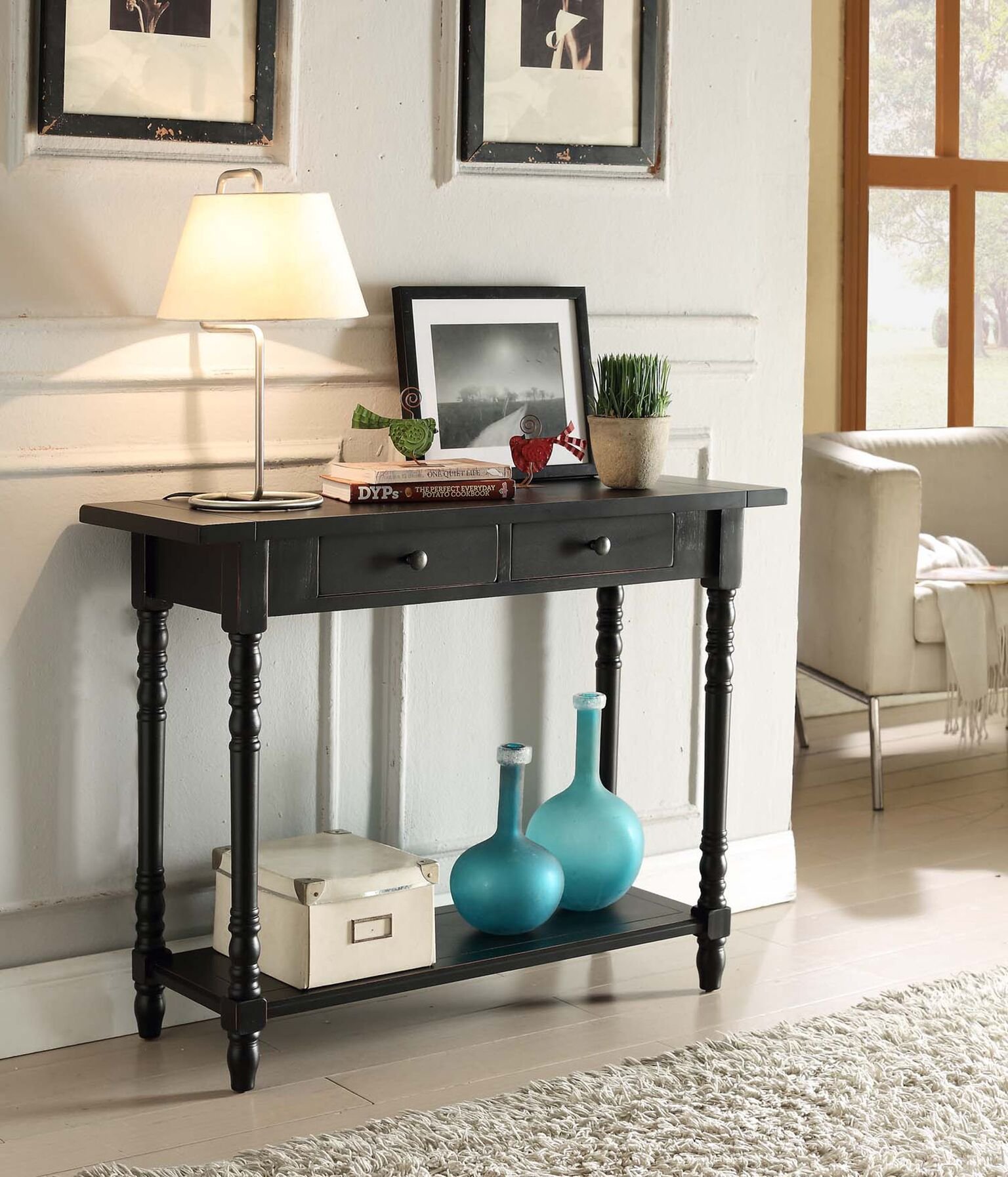 entry table with lamps and pictures