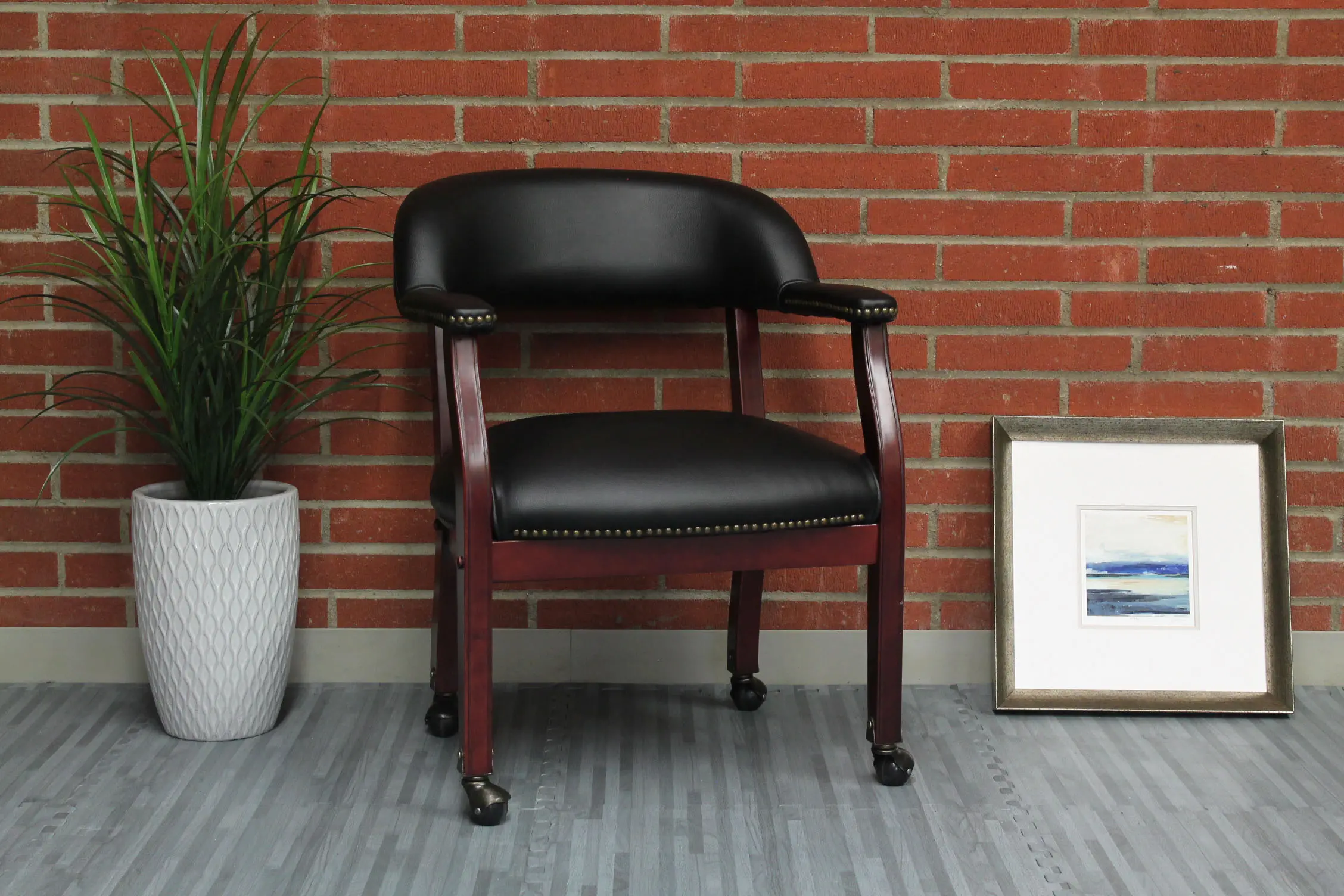 Boss Black Vinyl Guest Chair With Casters